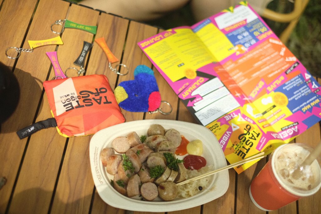 The visual identity of Taste of Saigon is a harmonious fusion of color and flavor, reflected across every touchpoint - from gift sets, badges, and event maps to banners and standees that are instantly recognizable to visitors
