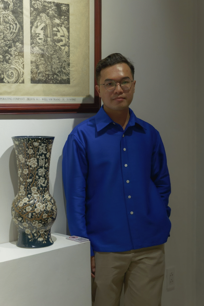 The exhibition ‘The Sacred in the Everyday’ – Traces of the sacred within the ordinary 3 Le Trung Hieu beside his work ‘Nhat Chi Mai’