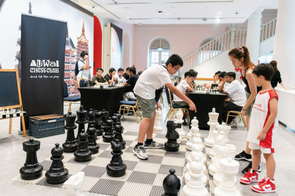 Young visitors are excited to play chess at the venue